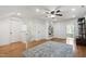 Spacious bonus room featuring hardwood floors, built in shelves and multiple entry points at 101 Eden Glen Dr, Holly Springs, NC 27540