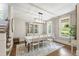Elegant dining room with a modern chandelier and hutch cabinet, perfect for hosting dinner parties at 101 Eden Glen Dr, Holly Springs, NC 27540