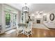 Bright kitchen and living space featuring hardwood floors and recessed lighting at 101 Eden Glen Dr, Holly Springs, NC 27540