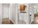 Convenient laundry room located near bedrooms with storage cabinets and a place to hang clothes at 101 Eden Glen Dr, Holly Springs, NC 27540