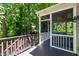 Cozy screened-in porch with wooded views, offering a relaxing outdoor space with privacy at 101 Eden Glen Dr, Holly Springs, NC 27540