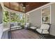 Inviting screened porch with comfortable seating, wood ceiling, and serene views of the lush surroundings at 101 Eden Glen Dr, Holly Springs, NC 27540