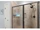 Beautiful shower with glass door and tile surround at 101 Eden Glen Dr, Holly Springs, NC 27540