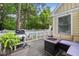 This back porch includes an outdoor kitchen area with a built-in grill and a cozy gas firepit at 102 Legacy Ln, Durham, NC 27713