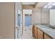 Well-lit bathroom with granite counters, light wood cabinets, and tile flooring and shower at 102 Legacy Ln, Durham, NC 27713