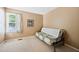 Neutral bedroom featuring a futon couch, carpet, and window with natural light at 102 Legacy Ln, Durham, NC 27713