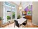 Eat-in kitchen features a spacious dining area with a large window overlooking lush greenery at 102 Legacy Ln, Durham, NC 27713