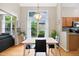 Bright dining area has natural light, an ornamental light fixture, and wood flooring at 102 Legacy Ln, Durham, NC 27713