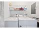 A well-lit laundry room with a washer and dryer and storage at 102 Legacy Ln, Durham, NC 27713