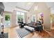 Inviting living room features hardwood flooring and ample natural light through large windows at 102 Legacy Ln, Durham, NC 27713