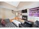 Bright living room features a fireplace, built-in shelving, and hardwood flooring at 102 Legacy Ln, Durham, NC 27713