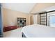 The neutral carpeted main bedroom has a barn door, an ensuite bathroom, and an organization system at 102 Legacy Ln, Durham, NC 27713