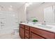 Bathroom features a double sink vanity with a tub and shower combination at 1049 Lakebrink Dr, Morrisville, NC 27560
