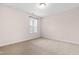 Bright bedroom with neutral carpet, and a window that offers a view of the community at 1049 Lakebrink Dr, Morrisville, NC 27560