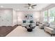Inviting living room with comfortable seating, a ceiling fan, and a decorative coffee table at 1049 Lakebrink Dr, Morrisville, NC 27560
