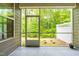 Screened porch overlooks backyard and showcases views of the trees at 1049 Lakebrink Dr, Morrisville, NC 27560