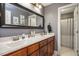 Bathroom featuring double sinks, granite countertops, and modern fixtures at 110 Lexington Ave, Zebulon, NC 27597