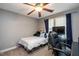 Cozy carpeted bedroom with a ceiling fan and plenty of room to relax or study at 110 Lexington Ave, Zebulon, NC 27597