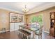 Bright dining room with built-in shelving and access to the backyard at 110 Lexington Ave, Zebulon, NC 27597