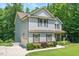 Two-story home with attached garage and attractive landscaping at 110 Lexington Ave, Zebulon, NC 27597