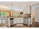 Bright kitchen showcasing stainless steel appliances, a mosaic backsplash, and a breakfast bar at 110 Lexington Ave, Zebulon, NC 27597