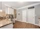 Well-lit kitchen featuring granite countertops, stainless steel appliances, and mosaic tile backsplash at 110 Lexington Ave, Zebulon, NC 27597