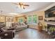Comfortable living room with hardwood floors, fireplace, and open floor plan at 110 Lexington Ave, Zebulon, NC 27597
