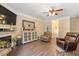 Cozy living room featuring a fireplace and comfortable seating at 110 Lexington Ave, Zebulon, NC 27597