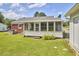 A view of backyard with a screened in porch at 1105 Horseshoe Rd, Durham, NC 27703