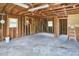 View of unfinished garage interior with exposed beams and concrete flooring, offering space for customization at 1105 Horseshoe Rd, Durham, NC 27703