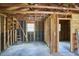 Unfinished garage interior featuring exposed framework, concrete floor, and windows for natural light at 1105 Horseshoe Rd, Durham, NC 27703