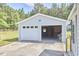This shows a large two-car garage with concrete driveway and plenty of room for storage and parking at 1105 Horseshoe Rd, Durham, NC 27703