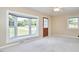 Cozy room features a large window, light beige walls, and neutral carpet at 1105 Horseshoe Rd, Durham, NC 27703