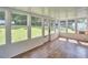 Sunroom with wood flooring and plenty of large windows offering natural light at 1105 Horseshoe Rd, Durham, NC 27703
