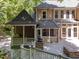 Multi-level deck featuring a grill, screened-in porch, and stone pizza oven at 11425 Horsemans Trl, Raleigh, NC 27613