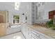 Bright bathroom featuring a soaking tub, shower, double vanity, and natural light from the window and skylight at 11425 Horsemans Trl, Raleigh, NC 27613