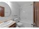 Bathroom featuring a tub with shower, sink, mirror, and toilet at 11425 Horsemans Trl, Raleigh, NC 27613