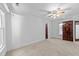 Bedroom with carpet, two doors, and a ceiling fan at 11425 Horsemans Trl, Raleigh, NC 27613
