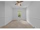 Spacious bedroom with cozy carpet, offering a light-filled retreat, and neutral walls at 11425 Horsemans Trl, Raleigh, NC 27613