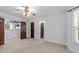 Large bedroom with neutral carpet, ceiling fan and ample natural light from window at 11425 Horsemans Trl, Raleigh, NC 27613