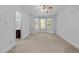 Spacious carpeted bedroom with bay window and ceiling fan, perfect for relaxing at 11425 Horsemans Trl, Raleigh, NC 27613