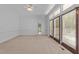 Bedroom featuring carpet flooring, and glass paneled doors that bring in a lot of light at 11425 Horsemans Trl, Raleigh, NC 27613