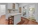 Cozy breakfast nook with white cabinets, seating, and access to the outdoor porch at 11425 Horsemans Trl, Raleigh, NC 27613