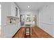 Bright breakfast nook with a bar top area, wooden floors and porch access at 11425 Horsemans Trl, Raleigh, NC 27613