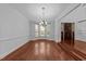 Elegant dining room with hardwood floors and a large bay window at 11425 Horsemans Trl, Raleigh, NC 27613