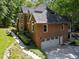 Brick home with three car garage and professionally landscaped front yard at 11425 Horsemans Trl, Raleigh, NC 27613
