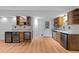 Basement kitchenette with two wine refrigerators and stainless-steel appliances at 11425 Horsemans Trl, Raleigh, NC 27613