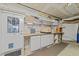 Finished basement storage area with ample shelving and an exterior door at 11425 Horsemans Trl, Raleigh, NC 27613