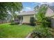 Tranquil backyard featuring lush greenery, a screened porch, and a well-kept lawn at 1208 Dunn Creek Xing, Wake Forest, NC 27587