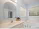 Well-lit bathroom with double sinks, bathtub, and windows with natural light at 1208 Dunn Creek Xing, Wake Forest, NC 27587